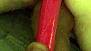 Video of a huge dildo in the puss and ass of an older woman