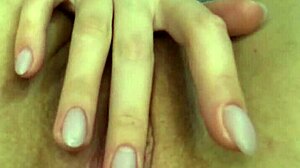 Girl pleases herself in close-up, put through fingers