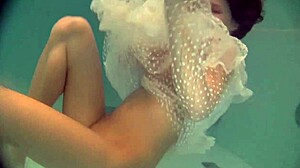 Natasha's underwater striptease: a short Russian teen’s exotic pool trip