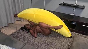 Tattooed Indian woman with a large banana gives her viewers a taste of her fun and provocative nature