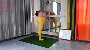 Regina noir in yellow tights doing amateur yoga in the gym